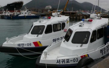 Two of the smaller Korea Coast Guard patrol boats at anchor.