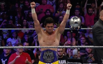 T.J. Perkins celebrates winning the CWC and becoming the new WWE Cruiserweight Champion.