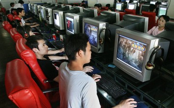 Chinese gamers play online computer games at an Internet cafe in Shanghai.