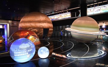 A visitor looks at displays at the Pingtang International Experience Planetarium in Guizhou Province.
