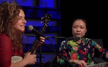 Abigail Washburn closes her eyes as she feels the music as Wu Fei looks at her during their performance at the radio show, “Music City Roots, Live from the Factory” on Dec. 9, 2015.