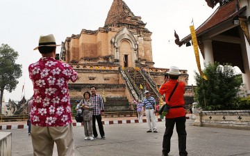 Chinese tourists have their photos taken at Wat Chedi Luang in Chiang Mai, Thailand.