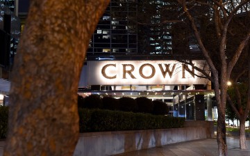 The Crown Resorts logo is displayed at the entrance of the Crown Towers hotel in Melbourne, Australia.