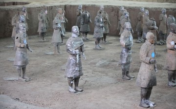 Some of the Terracotta Warriors in Xi'an, Shaanxi Province, are covered with protective plastic as they were being restored.