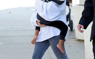 Kim Kardashian and baby North West step out of ther AirBnB apartment for the first time after million dollar heist of her jewelry at gunpoint on October 06, 2016 in New York, New York