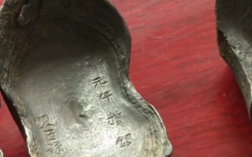 One of the silver ingots discovered at Minjiang River in Sichuan Province and believed to be part of the treasure of rebel leader Zhang Xianzhong. 