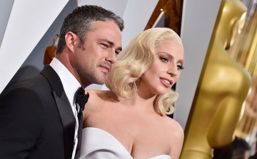 Recording artist Lady Gaga (R) and actor Taylor Kinney attend the 88th Annual Academy Awards at Hollywood & Highland Center on February 28, 2016 in Hollywood, California.