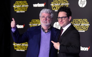 Filmmaker George Lucas (L) and writer-director J.J. Abrams attend the Premiere of Walt Disney Pictures and Lucasfilm's 'Star Wars: The Force Awakens' on December 14, 2015 in Hollywood, California.