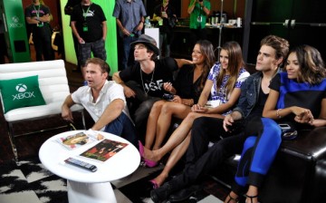 'The Vampire Diaries' actors Matthew Davis, Ian Somerhalder, TV personality Rocsi, actors Nina Dobrev, Paul Wesley and Kat Graham chat with fans over Skype for Xbox One in the Microsoft VIP Lounge during Comic-Con on July 26, 2014 in San Diego, California