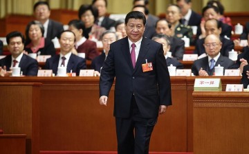 Xi Jinping attends the closing session of the National People’s Congress at the Great Hall of the People in Beijing on March 17, 2013 as newly elected president.