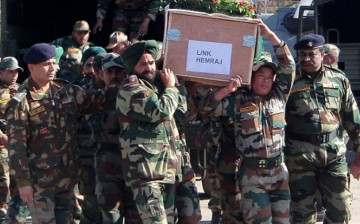 Indian Army soldiers bear the casket of their comrade, Lans Naik Hemraj, who was beheaded by Muslim terrorists.