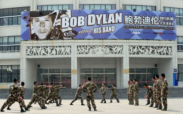 Chinese security personnel conduct drills outside the venue for U.S. music legend Bob Dylan's first concert in China in April 2011 in Beijing.