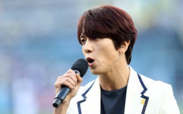 South Korean singing starJung Yong-Hwa performs the South Korean national anthem as part of 'Korea Night' fesitvities before the game between the Los Angeles Dodgers and the Cincinnati Reds at Dodger Stadium on May 27, 2014 in Los Angeles, California.