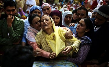 Relatives of a Kashmiri man mourn his violent death.    