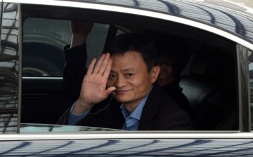 Alibaba founder and chairman Jack Ma waves as he leaves a hotel in Singapore following a meeting with investors in 2014.