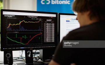 An employee of a Dutch financial company monitors the bitcoin exchange rate on his computer. 