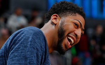 Anthony Davis enjoys a laugh during the game against the Atlanta Hawks at Philips Arena.