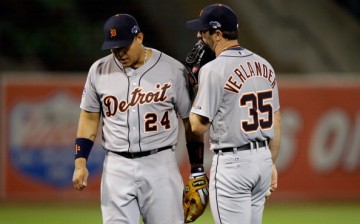 Miguel Cabrera talks with teammates Justin Verlander on the mound against the Oakland Athletics during Game Two of the 2013 ALDS.