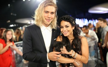 Actors Austin Butler (L) and Vanessa Hudgens pose with adoptable puppies from The Shelter Pet Project during the 2015 MTV Video Music Awards at Microsoft Theater on August 30, 2015 in Los Angeles, California. 