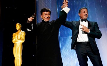Jackie Chan is congratulated by fellow actor Sylvester Stallone (R) after accepting his Honorary Award at the 8th Annual Governors Awards in Los Angeles, California, U.S., Nov. 12, 2016. 