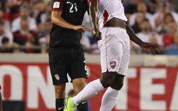 Trinidad and Tobago striker Kenwyne Jones (R) competes for the ball against Team USA's Steve Birnbaum.