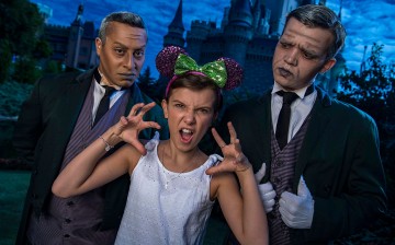 Netflix's 'Stranger Things' star Millie Bobby Brown, known as 'Eleven,' a girl with super powers against evil forces, poses with two 'grave diggers' at Magic Kingdom Park 6 in Lake Buena Vista, Florid