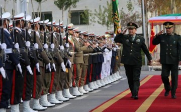 Chinese Defense Minister Gen. Chang Wanquan and Iranian Defense Minister Hossein Dakhan inspect a guard of honor in Tehran.