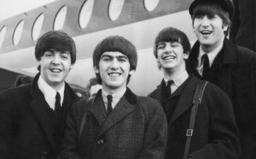 The Beatles, left to right, Paul McCartney, George Harrison, Ringo Starr and John Lennon (1940 - 1980) arrive at London Airport Feb. 6, 1964, after a trip to Paris.