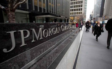 Pedestrians walk past a signage of JPMorgan in its headquarters in New York.