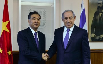 Chinese Vice Premier Wang Yang shakes hands with Israel Prime Minister Benjamin Netanyahu during their meeting in West Jerusalem in November last year.