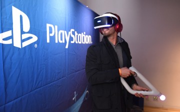 A young man trying Play Station VR at the Play Station 4 Pro