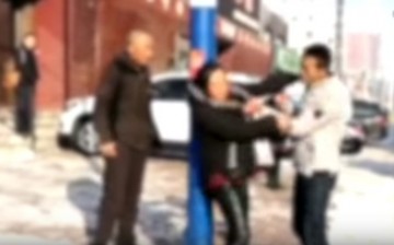 A screengrab from the video of a man attacking his parents.