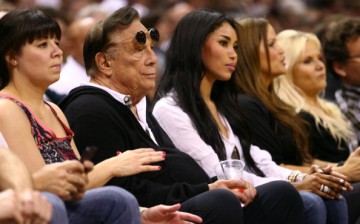 Former Los Angeles Clippers owner Donald Sterling and V. Stiviano watch the San Antonio Spurs play against the Memphis Grizzlies back in 2013.