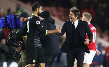 Chelsea striker Diego Costa (L) celebrates with head coach Antonio Conte.