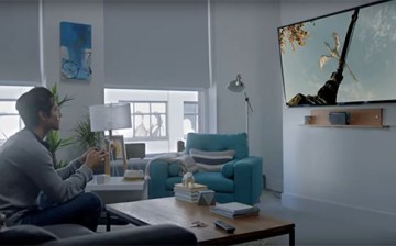 A man plays with a video game on the latest Nintendo Switch.
