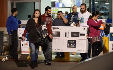 Shoppers pick up items on the eve of Thanksgiving sale