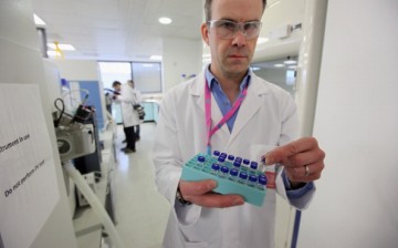  Analyst Christiaan Bartlett assesses samples in the anti-doping laboratory which will test athletes' samples from the London 2012 Games on Jan. 19, 2012, in Harlow, England.
