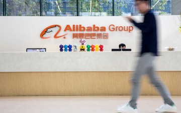 An employee walks past the reception counter at Alibaba headquarters in Hangzhou.