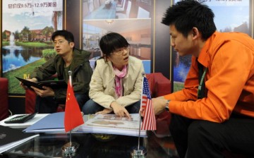 Chinese real estate investors inquire about United States property for sale at the Overseas and China Property Expo in Beijing.