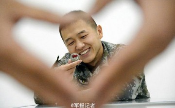 Chinese veterans put together a series of photos before they retire. The heart gestures express their gratitude and love for the army. 