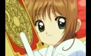A screenshot of Sakura Kinimoto with one of the Claw cards in her hand. 
