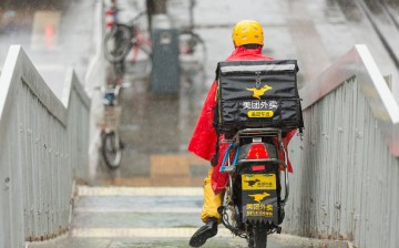 A food courier en route to deliver meals in Beijing.
