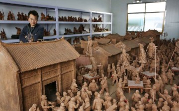 Miao Chunsheng's house is filled with clay sculptures. 