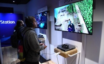 Fans try out PlayStation 4 Pro demos at the midnight launch event at Sony Square NYC on November 9, 2016 in New York City. 