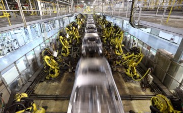 Robots are seen at work in a car manufacturing facility in Beijing.