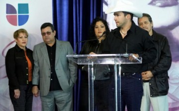 Marcela, Abraham, and Suzette Quintanilla along with actor Edward James Olmos (L-R) listen as Tejano music artist Bobby Pulido speaks during the 'Selena ?Vive!' press conference February 3, 2005 in Houston, Texas.   
