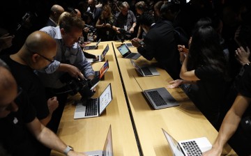 Press members attend an Apple event showcasing the tech company's new products.