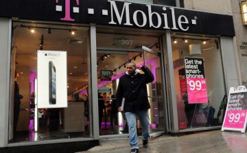 A man walks out of a Manhattan T-Mobile store in New York City.