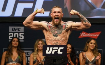 Conor McGregor poses during the weigh-ins for UFC 205.