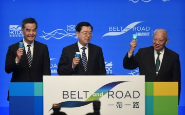 Hong Kong Chief Executive Leung Chun-ying (L), Zhang Dejiang (C) and former Hong Kong chief executive Tung Chee-hwa (R) open the Belt and Road Summit in Hong Kong on May 18, 2016.